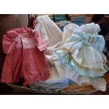 Large collection of old dolls dresses in silk and cotton