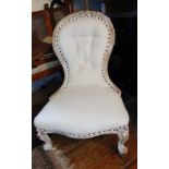 Victorian spoonback nursing chair with white washed finish, and re-covered in a white linen fabric