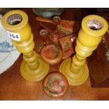Large pair of turned wooden painted candlesticks and a collection of matching wooden items decorated