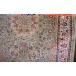 Modern Keshan rug on pale green ground, 2.00m x 1.40m