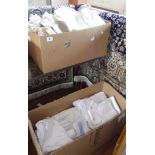 Two large boxes of linen and lace tablecloths etc.