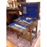 Early 20th century oak cutlery canteen containing a set of silver plated cutlery