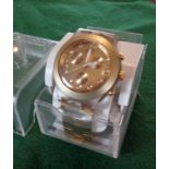 Gold coloured chunky men's Swatch watch in case