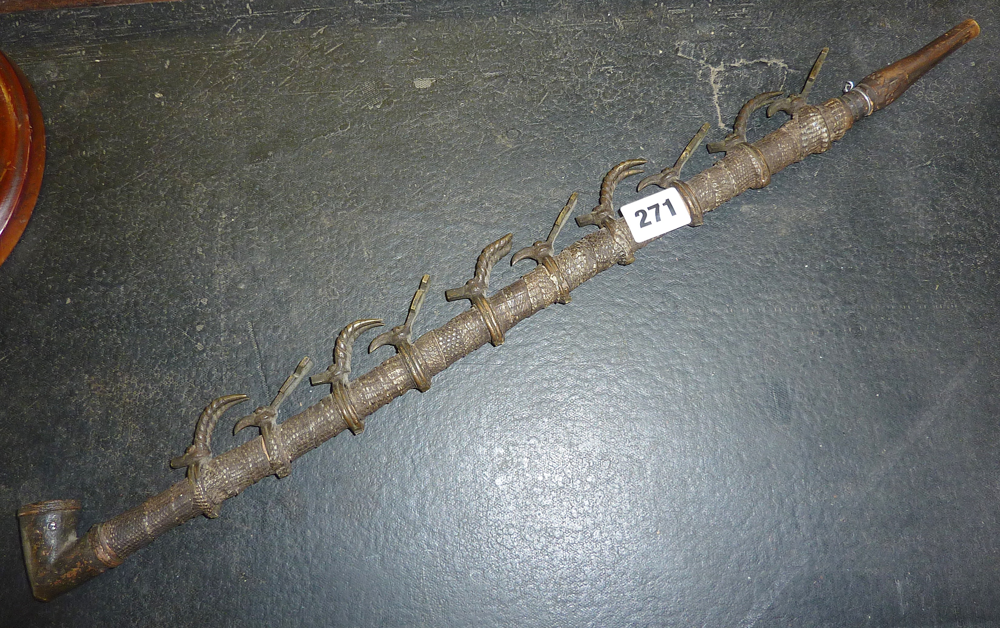 Tribal Art: Snakeskin and brass figural pipe from the Bamileke, Cameroon