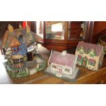 Folk Art painted papier mache house money box, a wooden similar and a Dr Barnardo's pressed card