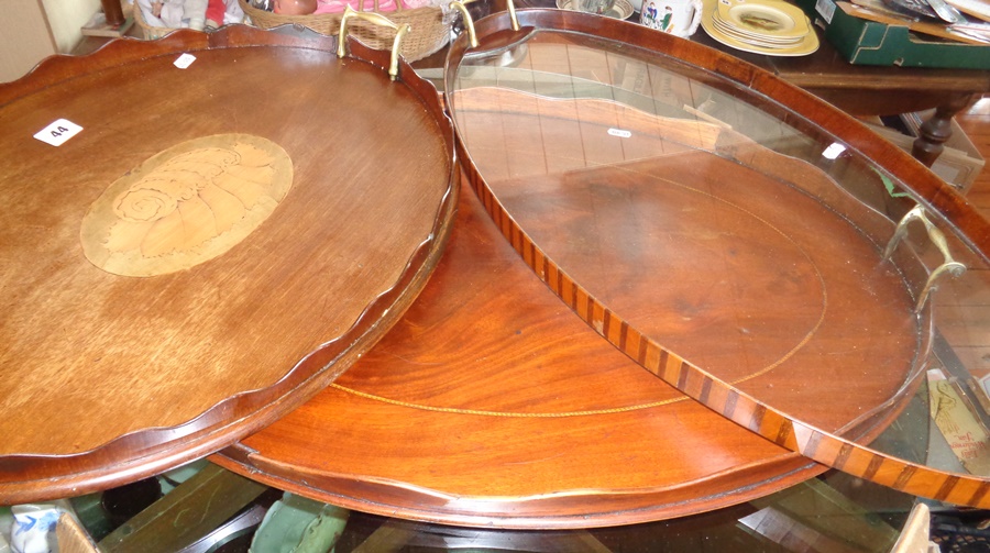 Three Edwardian oval mahogany butler's trays with galleries and brass handles