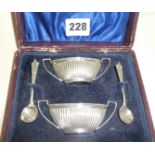 Cased pair of silver Adams style salts, and pair of silver salt spoons, all hallmarked for