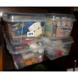 Four boxes containing assorted vintage sewing items and accessories