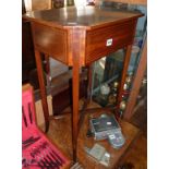Edwardian inlaid mahogany work table having lift up lid enclosing fitted leather covered interior,