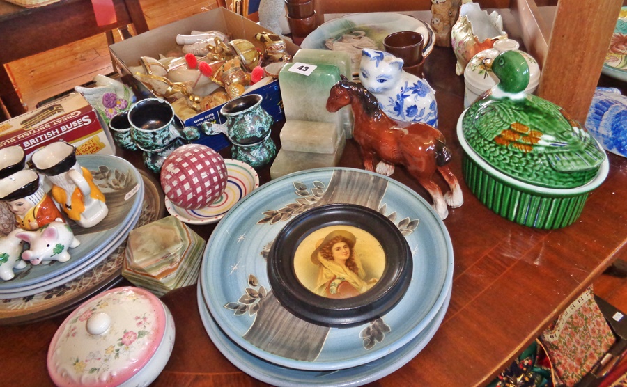 Large quantity of assorted pottery plates, etc, inc. a carpet bowl