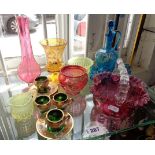 Collection of assorted coloured glassware including Cranberry, overlay blue glass and vaseline glass