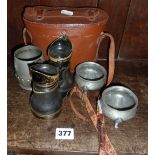 A pair of pre-war Woolensak field/opera glasses in leather case, a pair of pewter salts and a