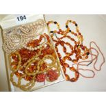 Good quantity of Art Deco period amber and coral necklaces, other jewellery, etc.