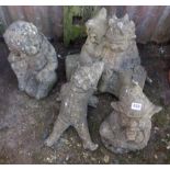 Four stonework garden gnomes