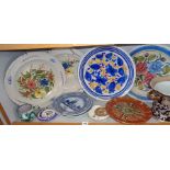 Four Continental polychrome floral tin glaze chargers, (one marked verso "R.C.") and other ceramics,