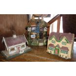 Folk Art painted papier mache house money box, a wooden similar and a Dr Barnardo's pressed card