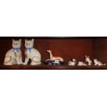 Pair of pottery cats, a Staffordshire greyhound and five Royal Doulton cat figurines (one with