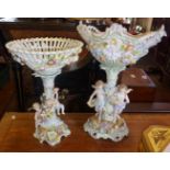 Austrian or German porcelain figural centrepieces, decorated with cherubs and flowers (both