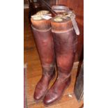 Pair of Edwardian gentleman's leather riding boots with wooden trees, bearing label for J. Watkins,
