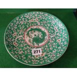 Chinese dragon plate on green prunus ground, 22cms dia., character mark