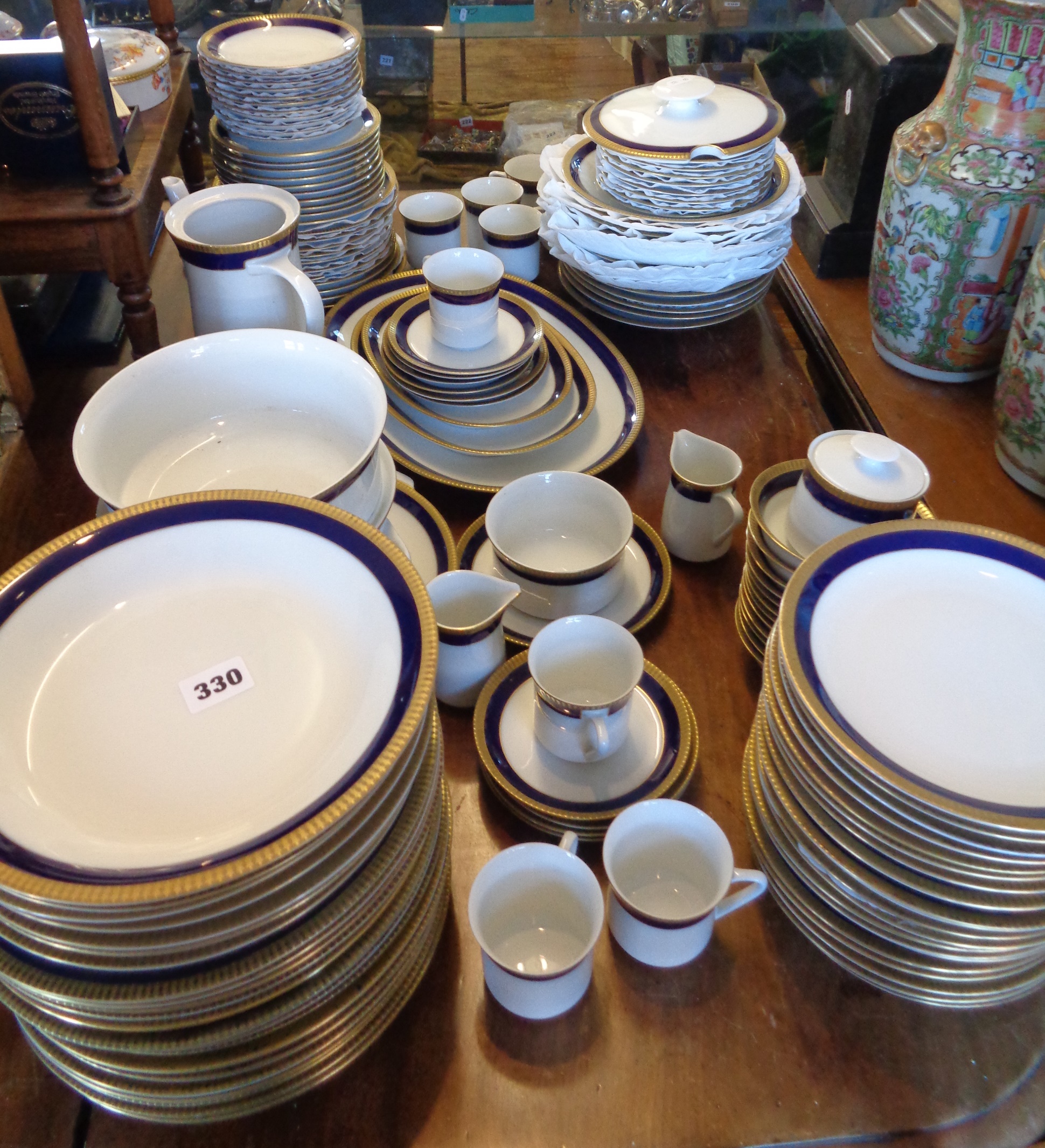 Extensive Thomas China of Germany Dinner and Coffee Service, in white with blue and gold border