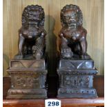 Pair Chinese bronze lion dogs on plinths, 20cms high