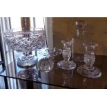 Large cut-glass bowl on stem and a pair of similar candlesticks