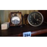 An old Smiths car clock and a chrome plated volt meter