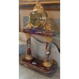 20th century onyx and gilt metal mantle clock, with modern movement standing on classical pillars