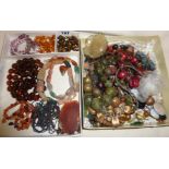 Assorted vintage beaded necklaces, including amber, tiger's-eye etc