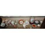 Shelf of miniature floral china items including Limoges, Chinese vases etc