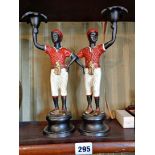 Pair painted bronze figural candlesticks in the form of native servant boys