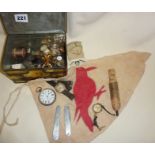 Penknives, wristwatches, whistle, pocket watch and other collectables in a tin