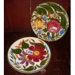 Two hand painted floral Wade plates
