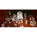 Shelf of some Swarovski crystal animals and other miniature items