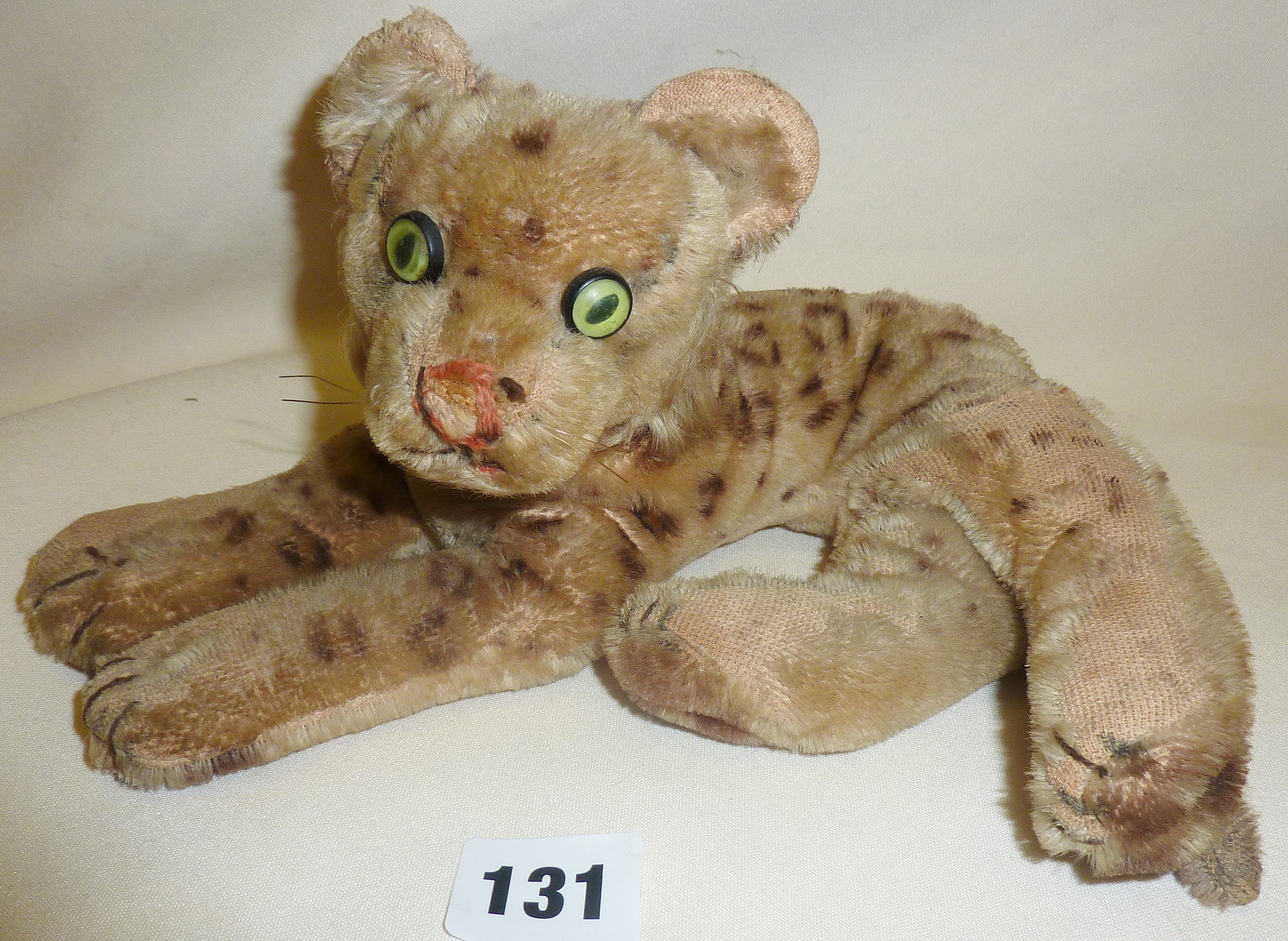 Vintage leopard with green eyes stuffed toy, possibly Steiff