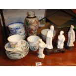 Chinese porcelain bowls and saucers, crackleware vase, blanc-de-chine figures on stands etc
