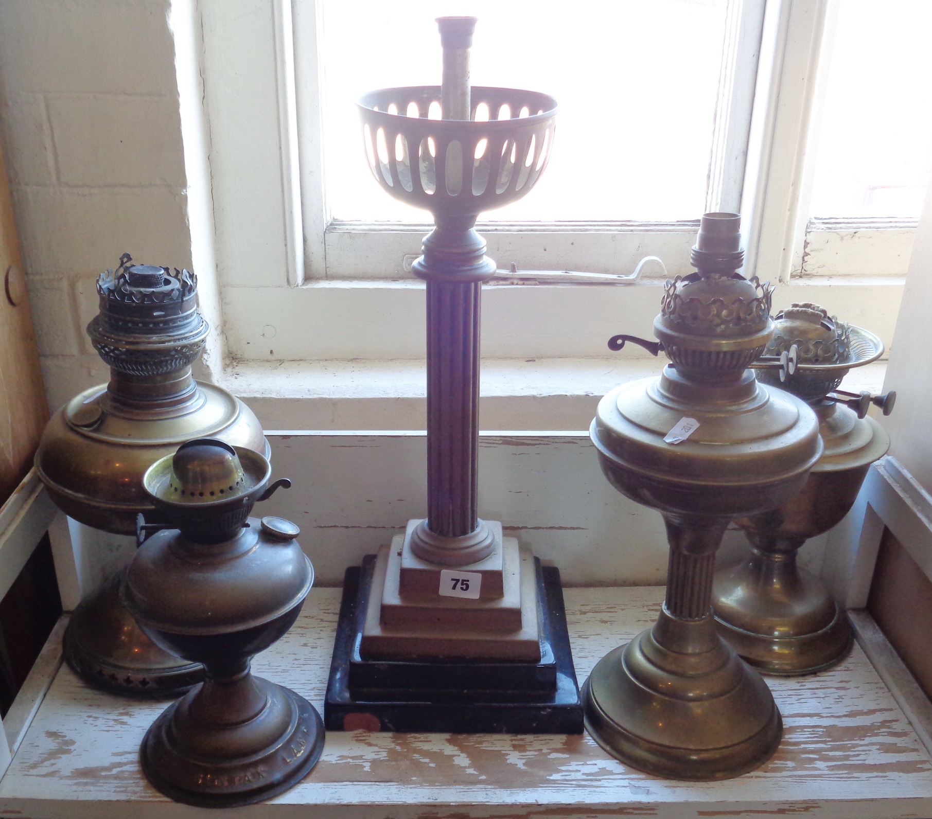 Victorian brass column oil lamp base and four brass oil lamps