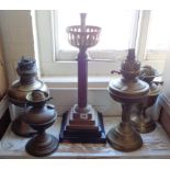 Victorian brass column oil lamp base and four brass oil lamps