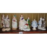 Shelf of Continental porcelain figures