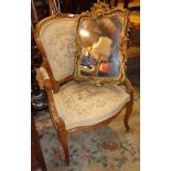 French walnut open armchair with tapering seat and back, early 20th century and a gilt gesso mirror