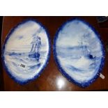 Pair of Royal Crown Derby blue and white shaped plaques with sailing vessels decoration