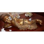 Oriental giltwood figure of a reclining Buddha, 48cm long