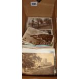 Box containing old and vintage postcards, mainly scenes of Clevedon, Somerset