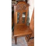 Arts and Crafts carved oak hall chair