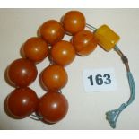 Old large butterscotch egg yolk amber prayer beads of Islamic origin, weight c. 102g