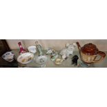 Long shelf of figurines, Doulton stoneware teapot and an Imari bowl