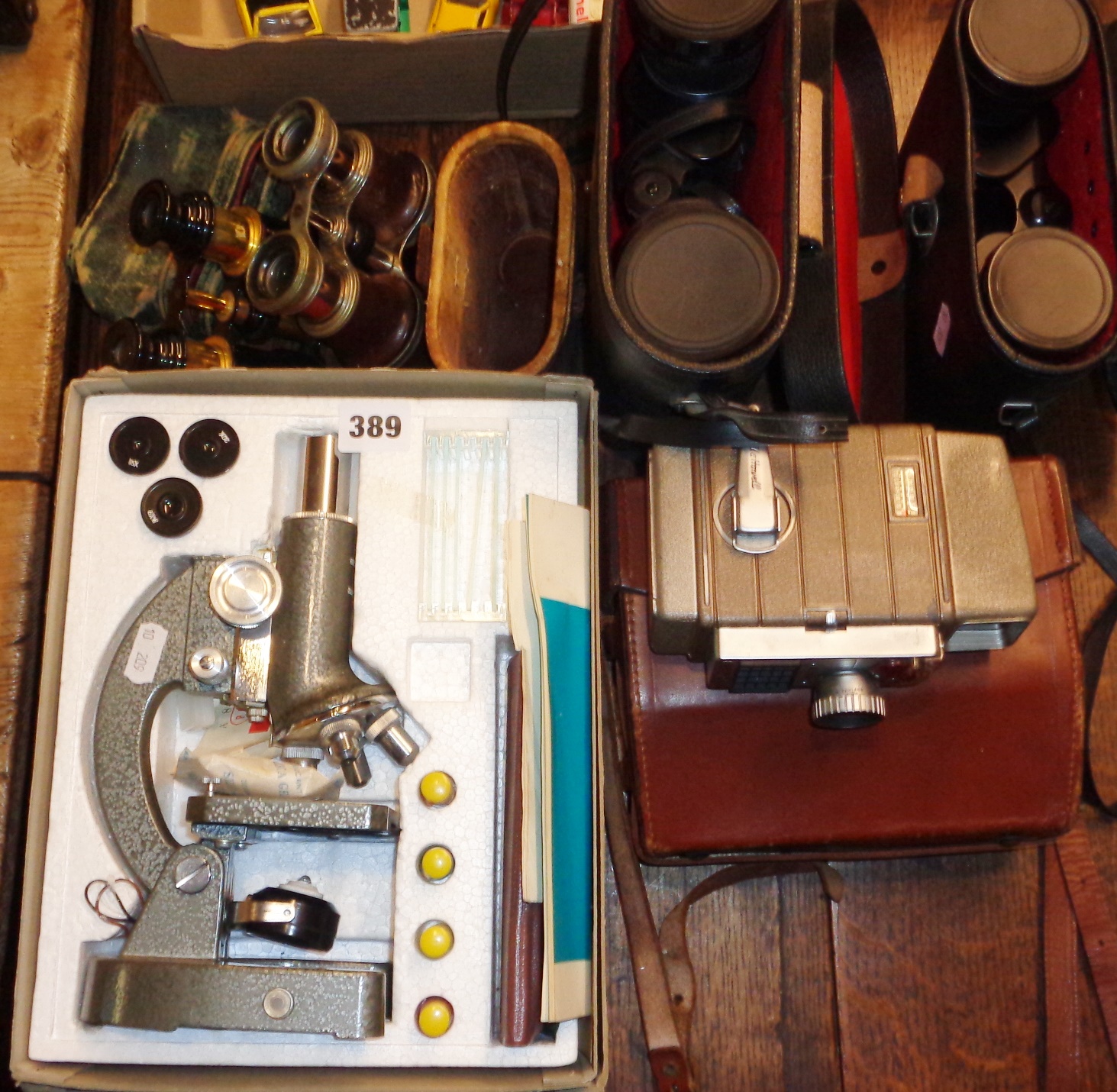 Old cased binoculars and opera glasses, two vintage pairs of binoculars, microscope and Bell &