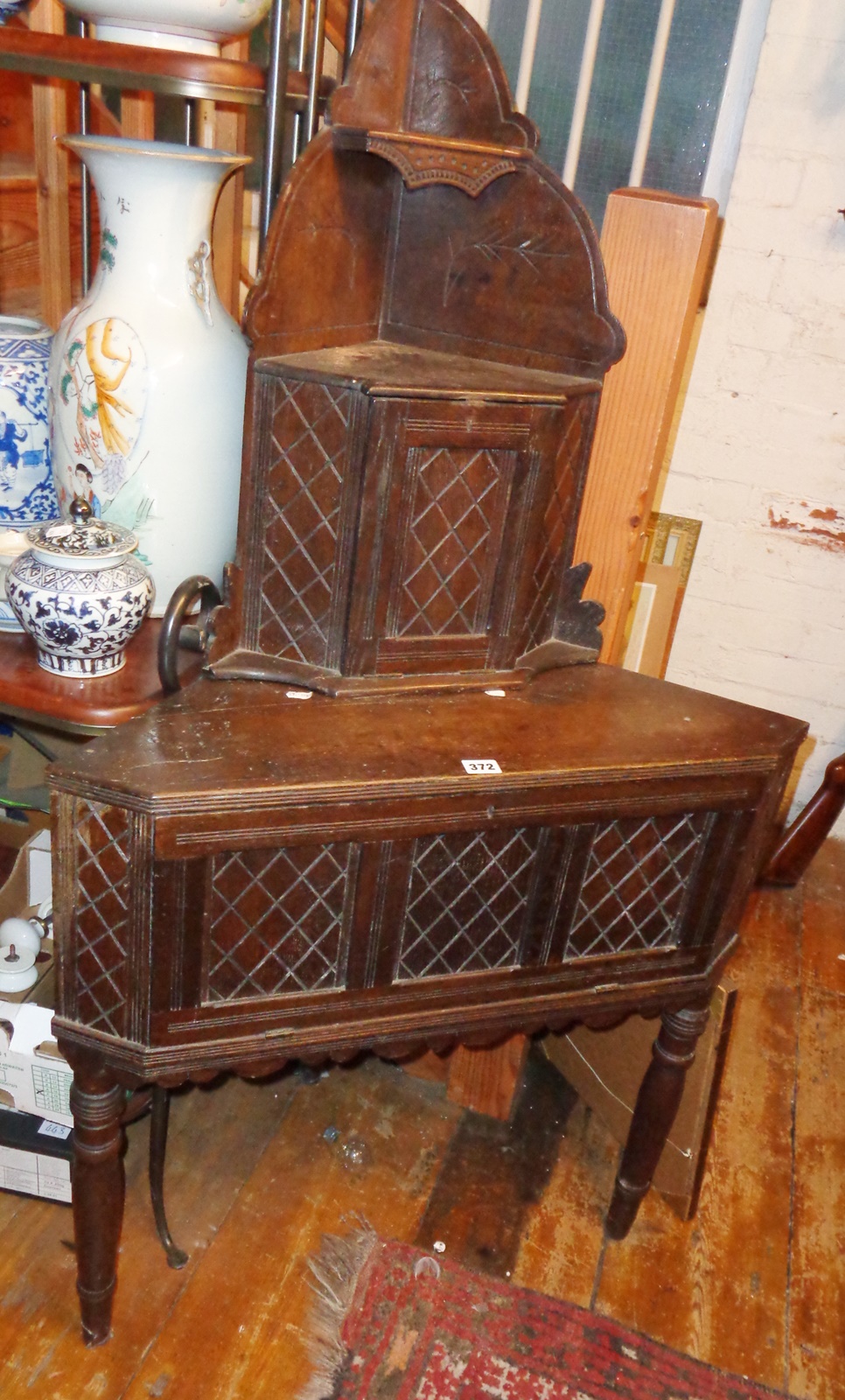 Jacobean style Victorian carved and tiered oak floor standing corner cupboard