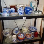 Two shelves of assorted pottery and china